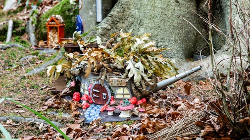 A watering can house on the woodland fairy trail